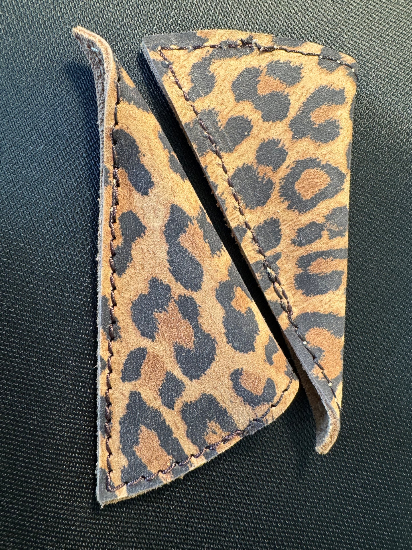 Our most popular Sun and Shield is the genuine cow leather printed with a leopard skin design.